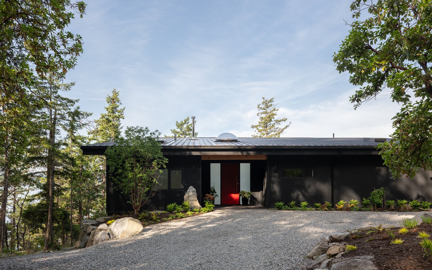 Oles Cove, the long entry elevation with a red door at its centre